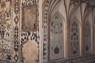 Close-up of a traditional lipen art wall piece showcasing earthy textures and intricate mirror work.