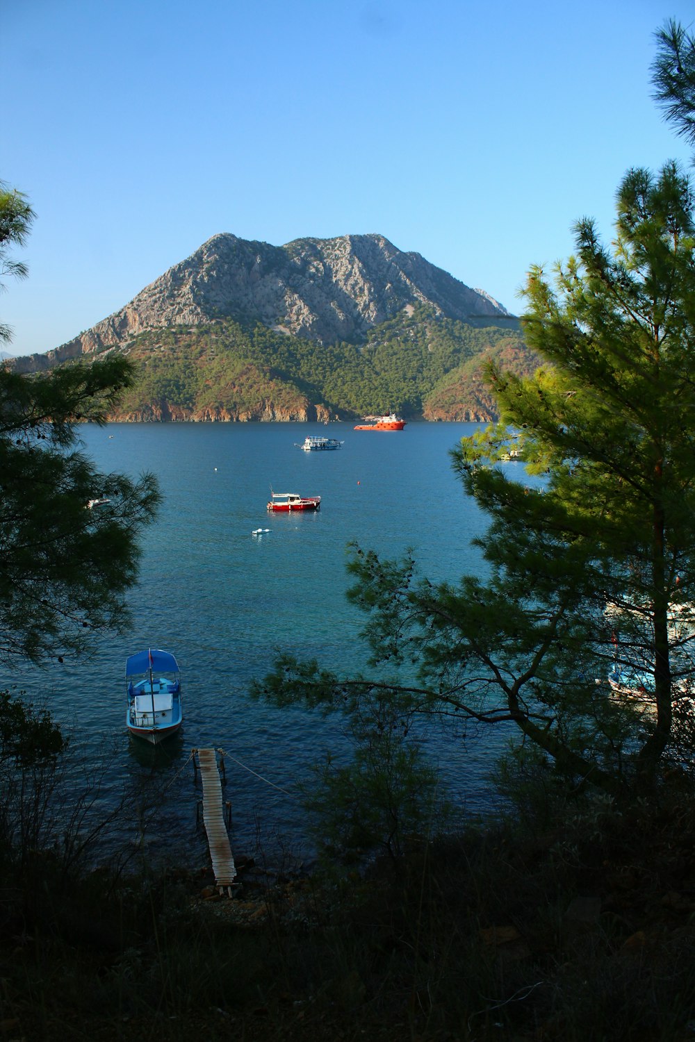 several boats floating on a large body of water