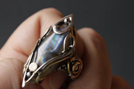 A vintage Zuni ring featuring delicate inlay work with vibrant stones.