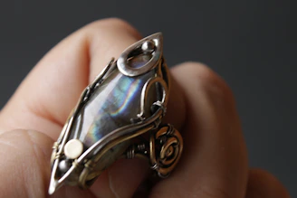 A vintage Zuni ring featuring delicate inlay work with vibrant stones.