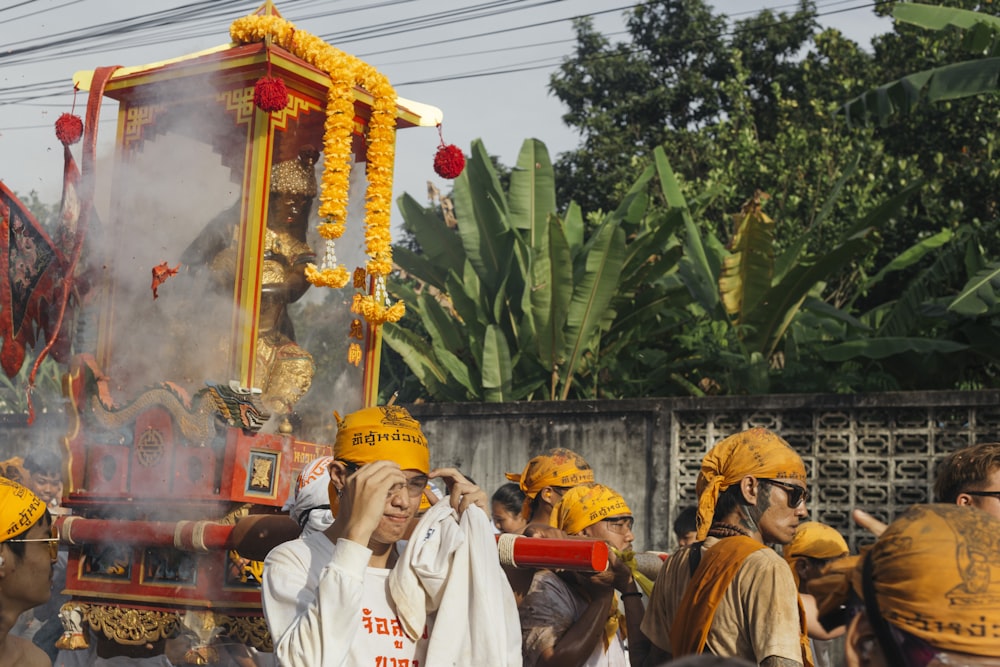 a group of people standing around a float