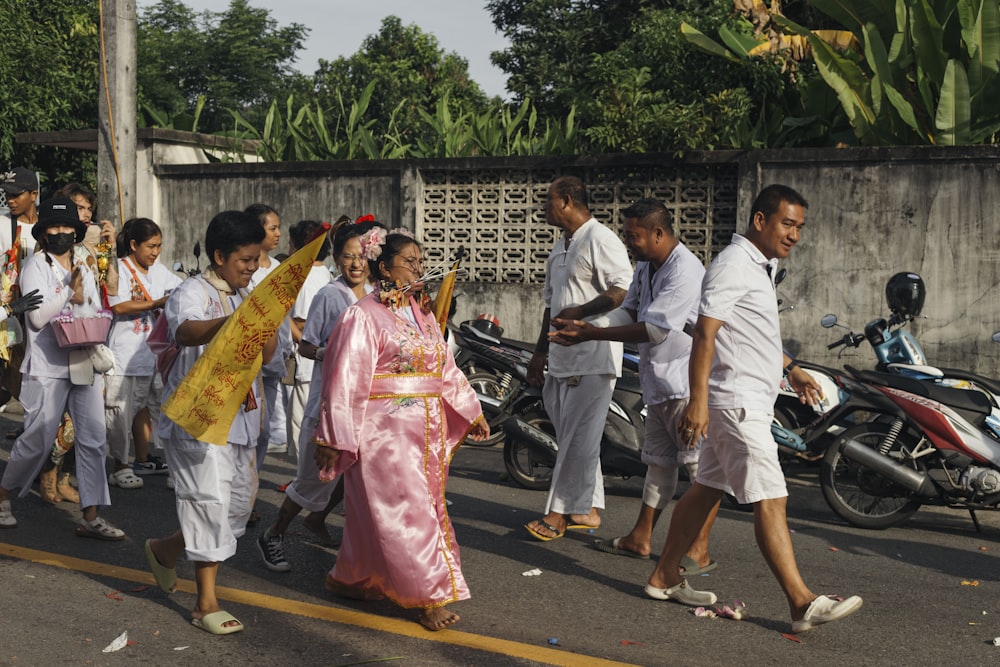 a group of people walking down a street