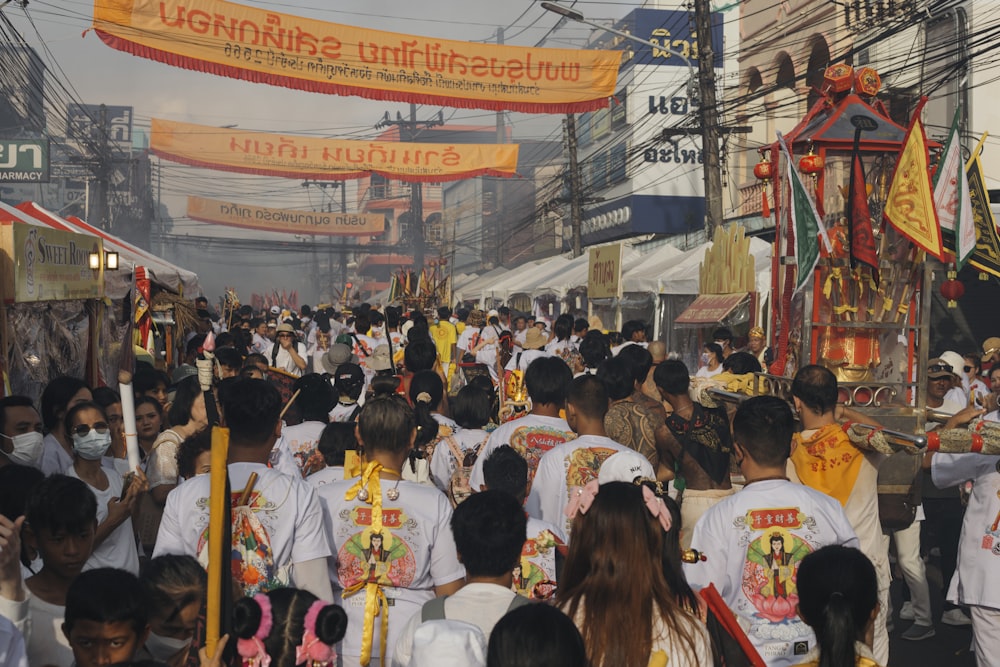 a large group of people walking down a street