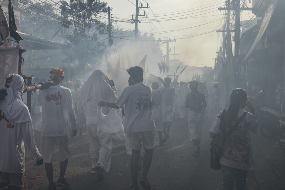 a group of people walking down a street