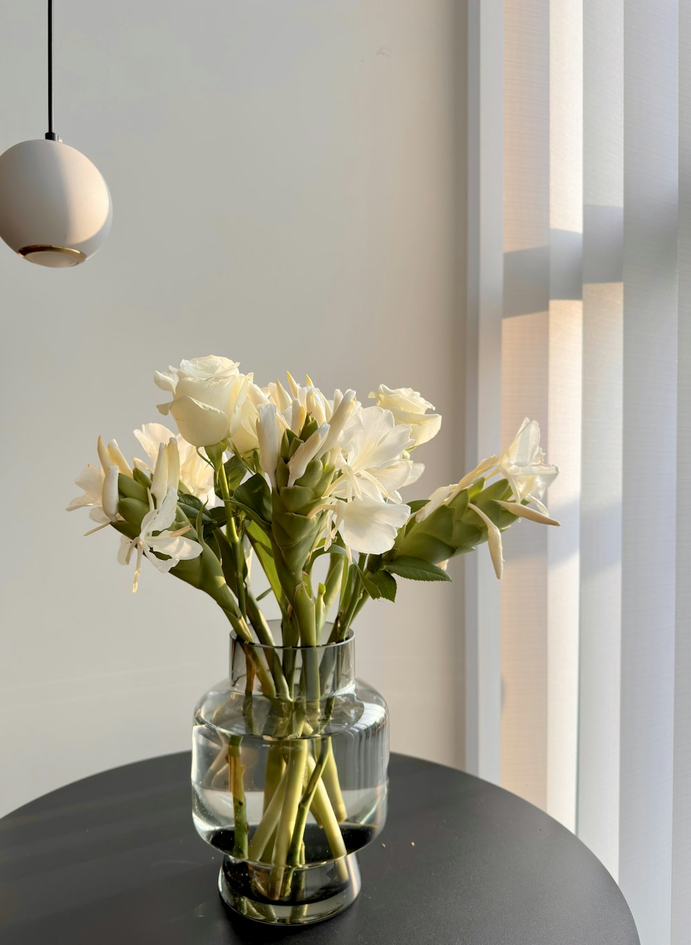 a vase of flowers sitting on a table