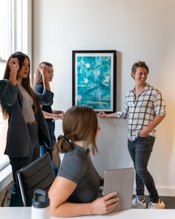 A group presentation with diverse professionals discussing project results.