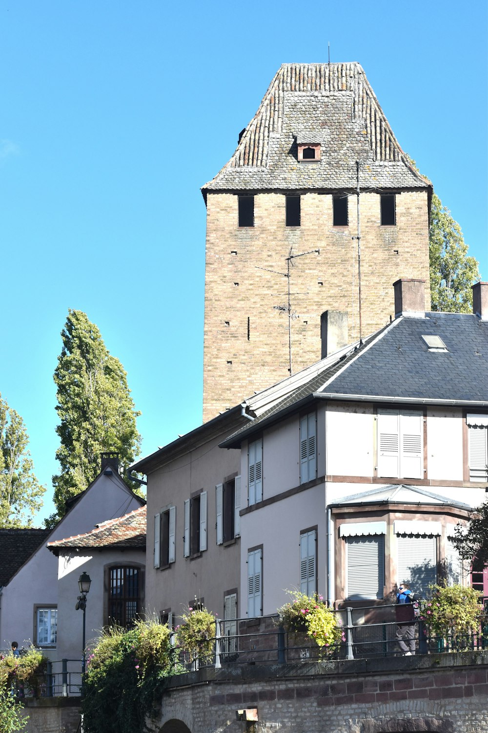 a large brick building with a clock tower in the background