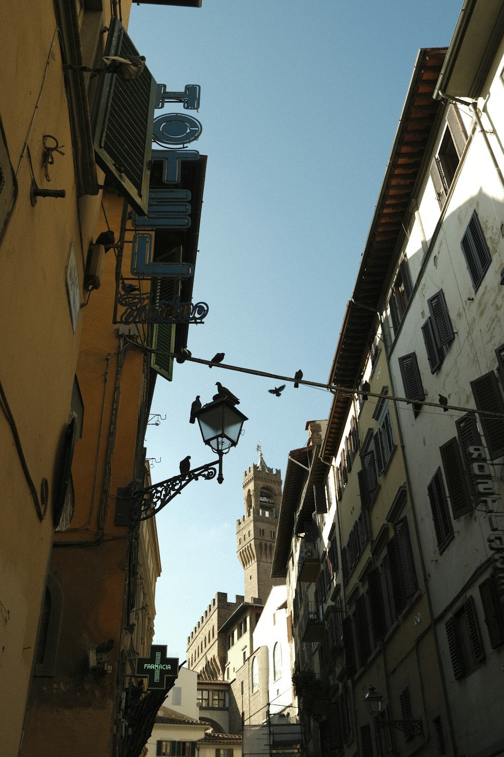 a street light hanging from the side of a building