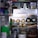 An organized refrigerator filled with various items, including bottles, cans, and containers. The top shelves hold jars and cartons, while the middle section contains several canned drinks and bottles of wine or sparkling water. The lower shelves have food containers, possibly containing leftovers or prepared meals.