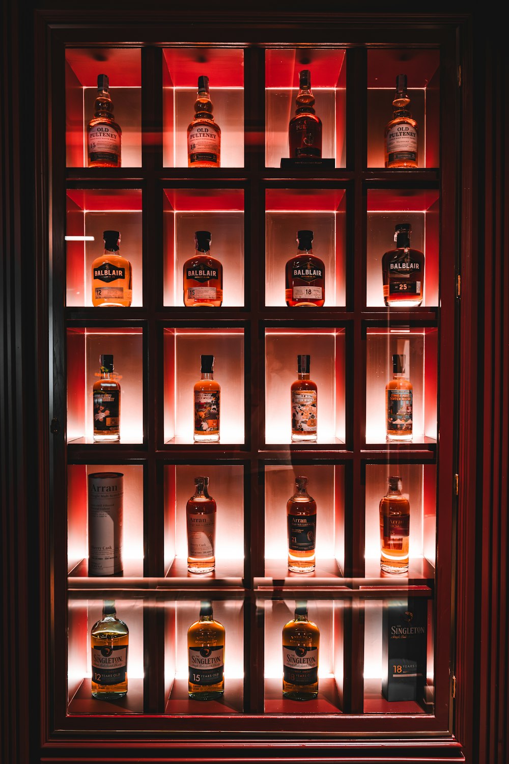 a display case filled with bottles of liquor