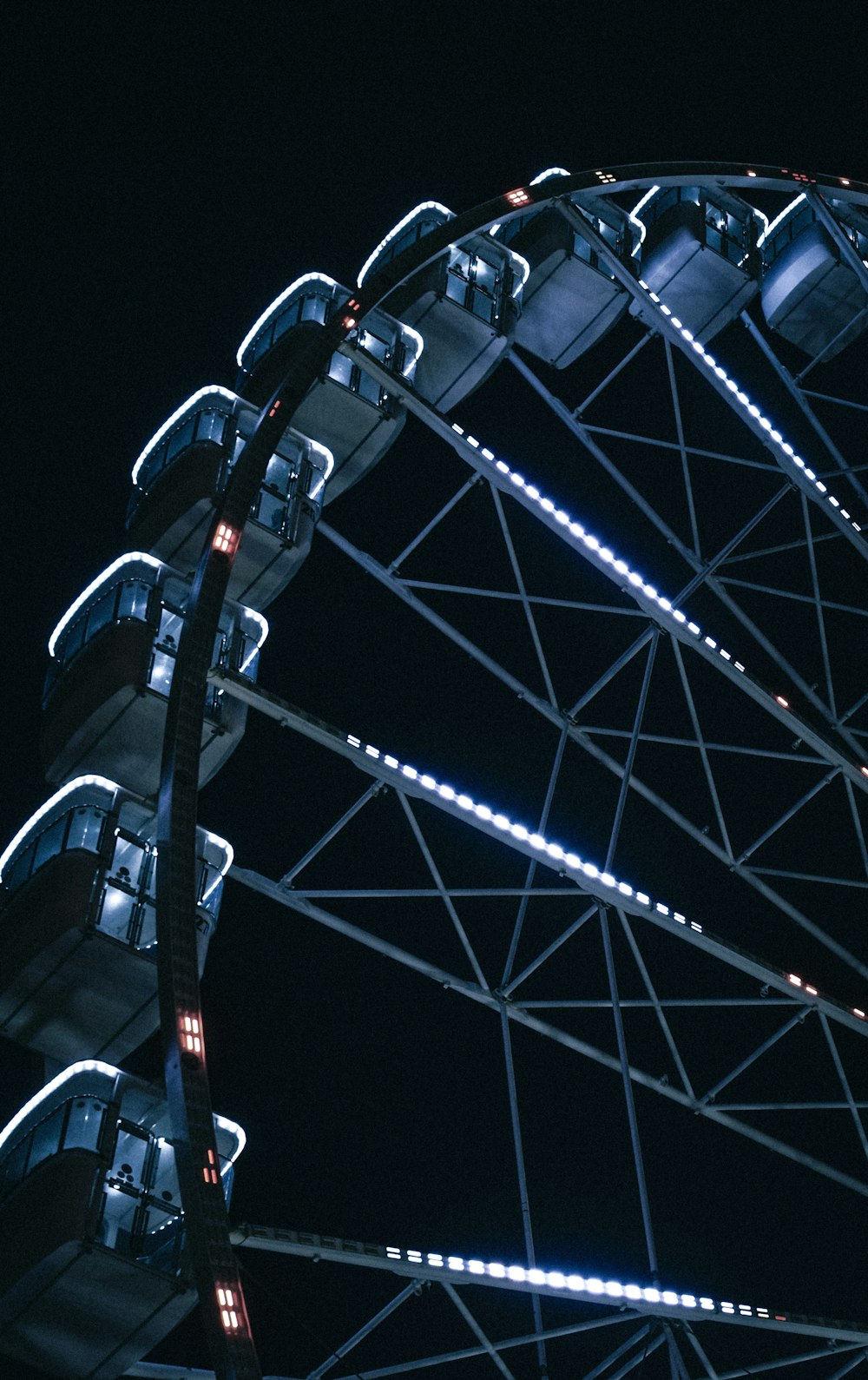 a large ferris wheel lit up at night