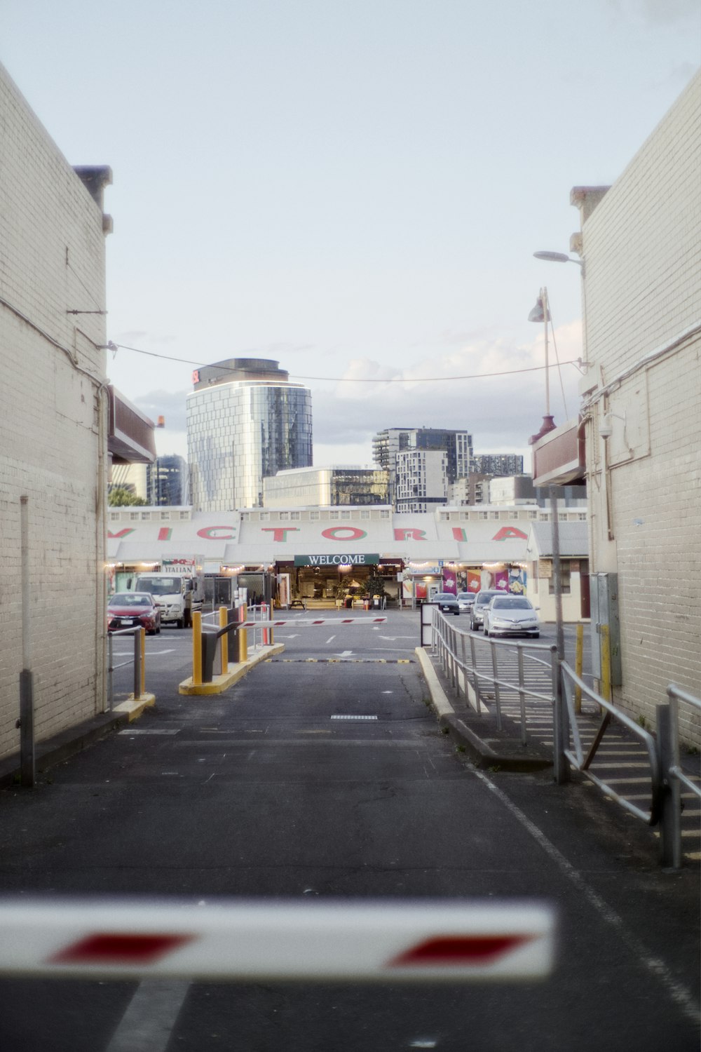 a city street with a bridge over it