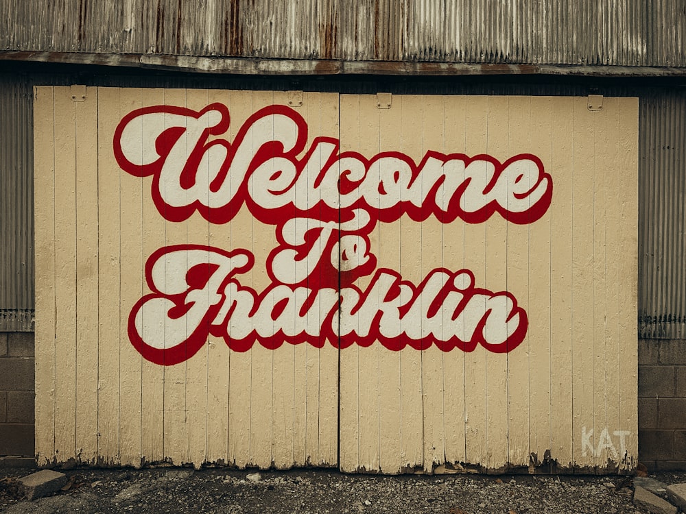 a welcome to franklin sign painted on the side of a building
