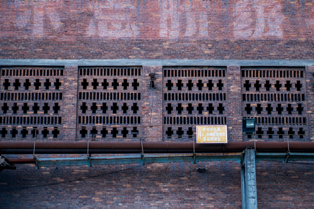 a brick building with a sign on the side of it