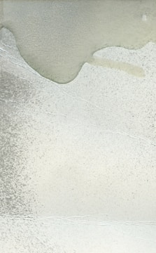 Close-up of a softly glowing abstract painting with delicate light gradients.