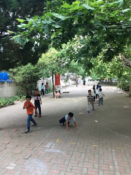 A group of children playing in a safe outdoor space.