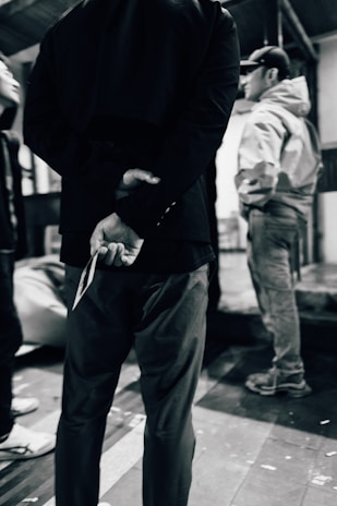 a man holding a pair of scissors in his hand