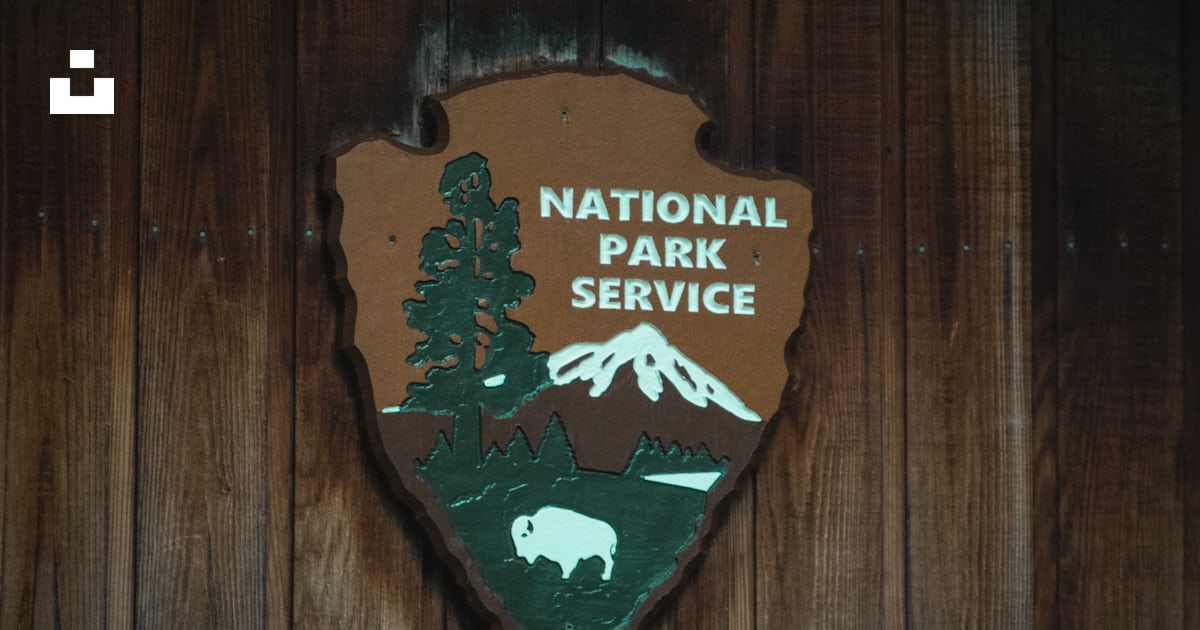 A national park service sign on a wooden wall photo – Free Wood Image ...