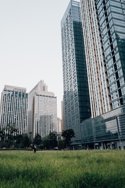 a couple of tall buildings sitting next to each other