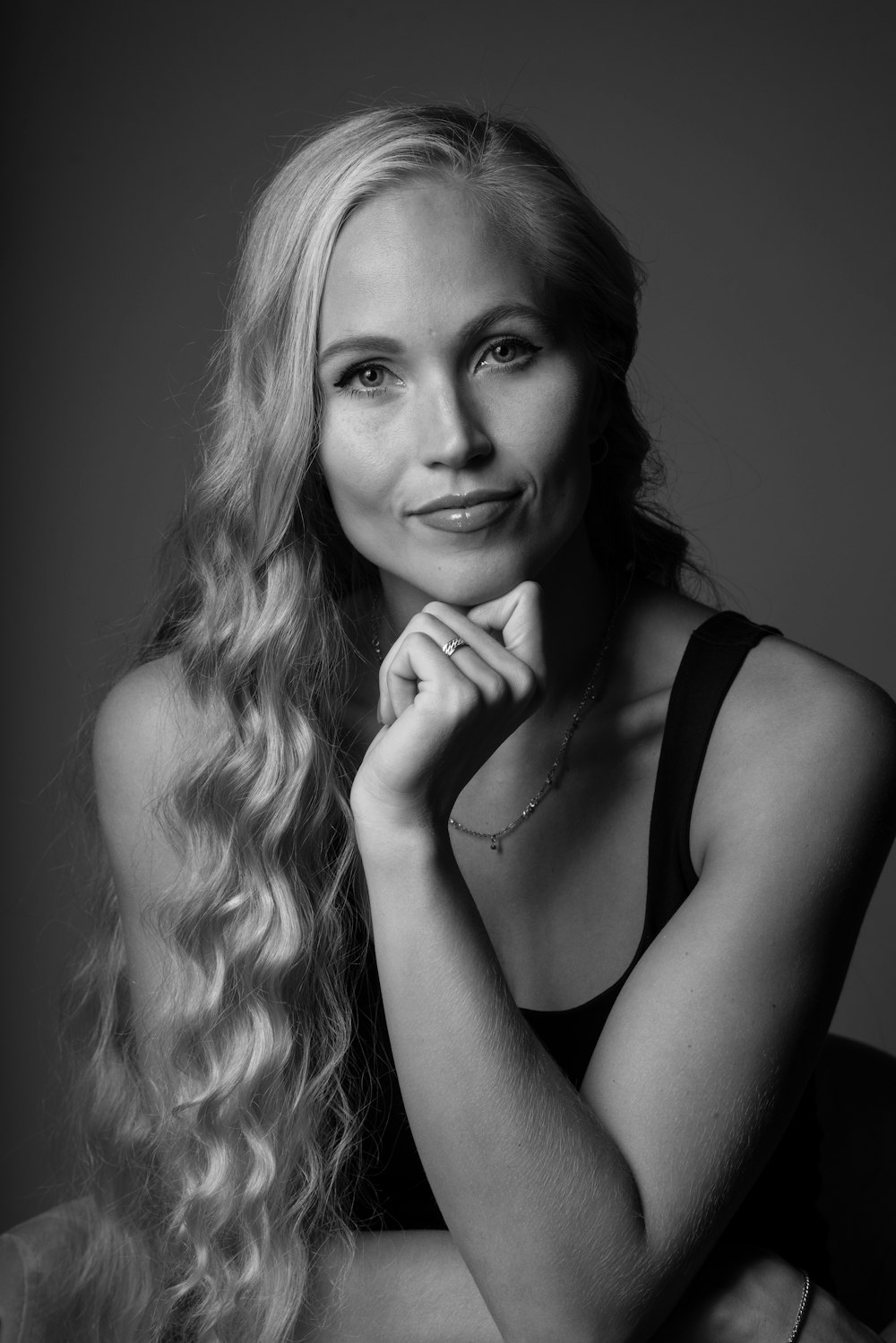 a black and white photo of a woman with long hair