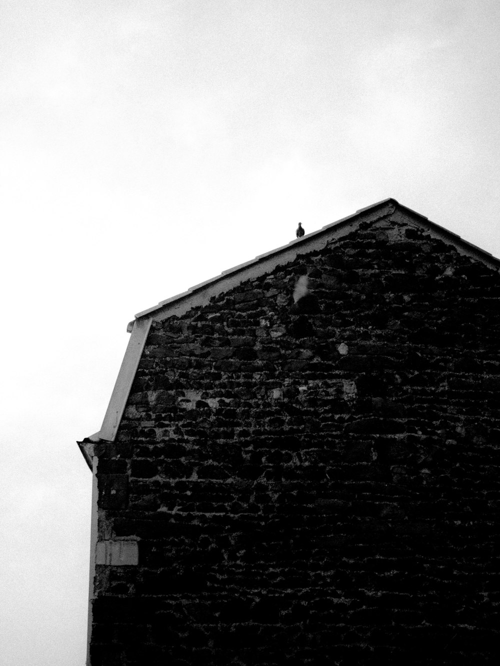 a black and white photo of a brick building