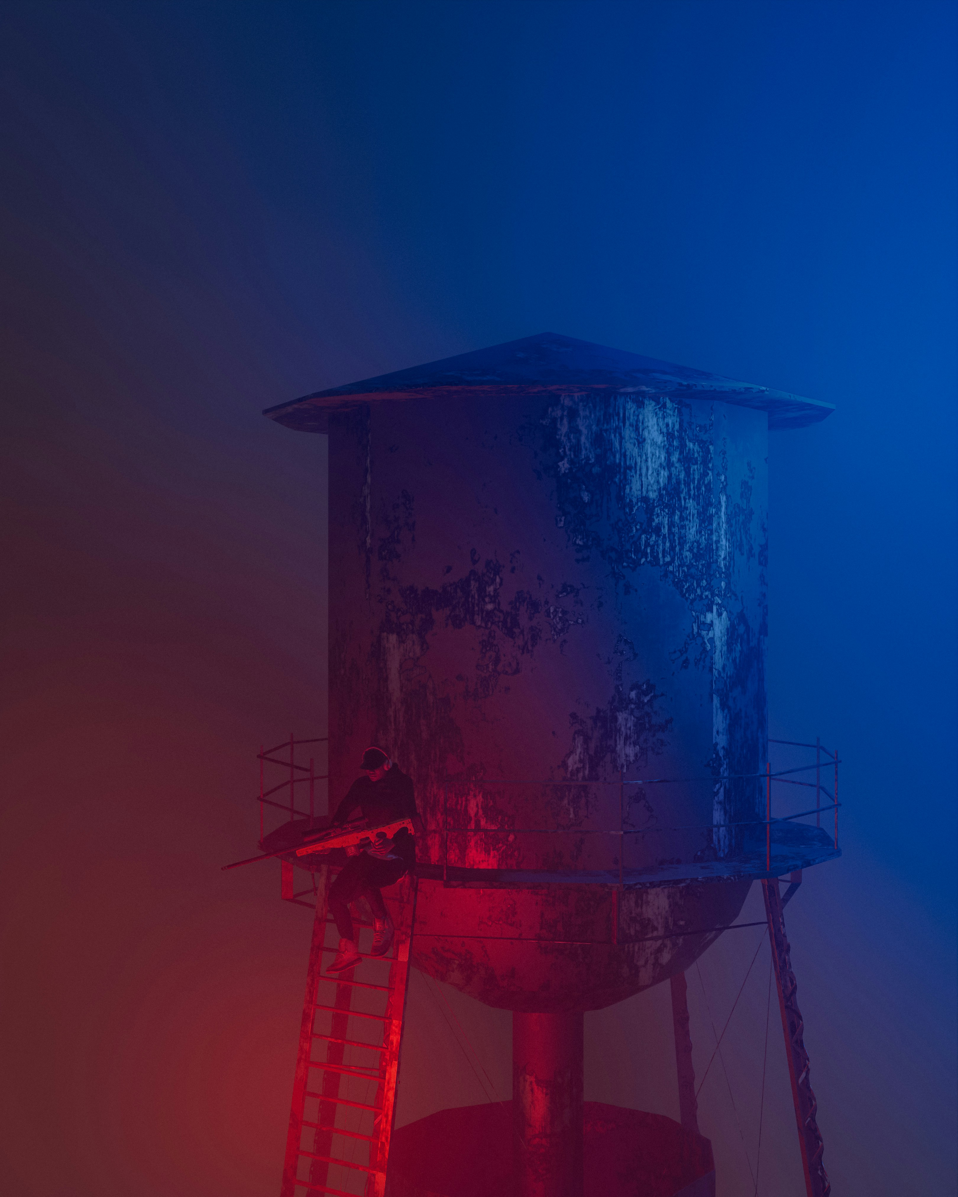 a red and blue photo of a water tower