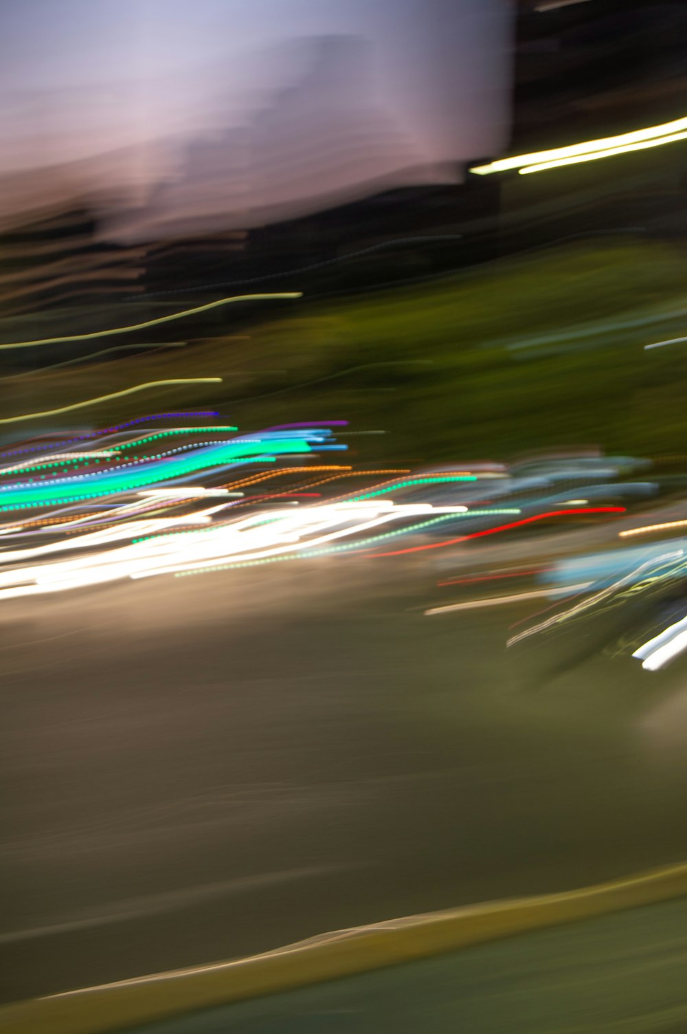 a blurry photo of a city street at night