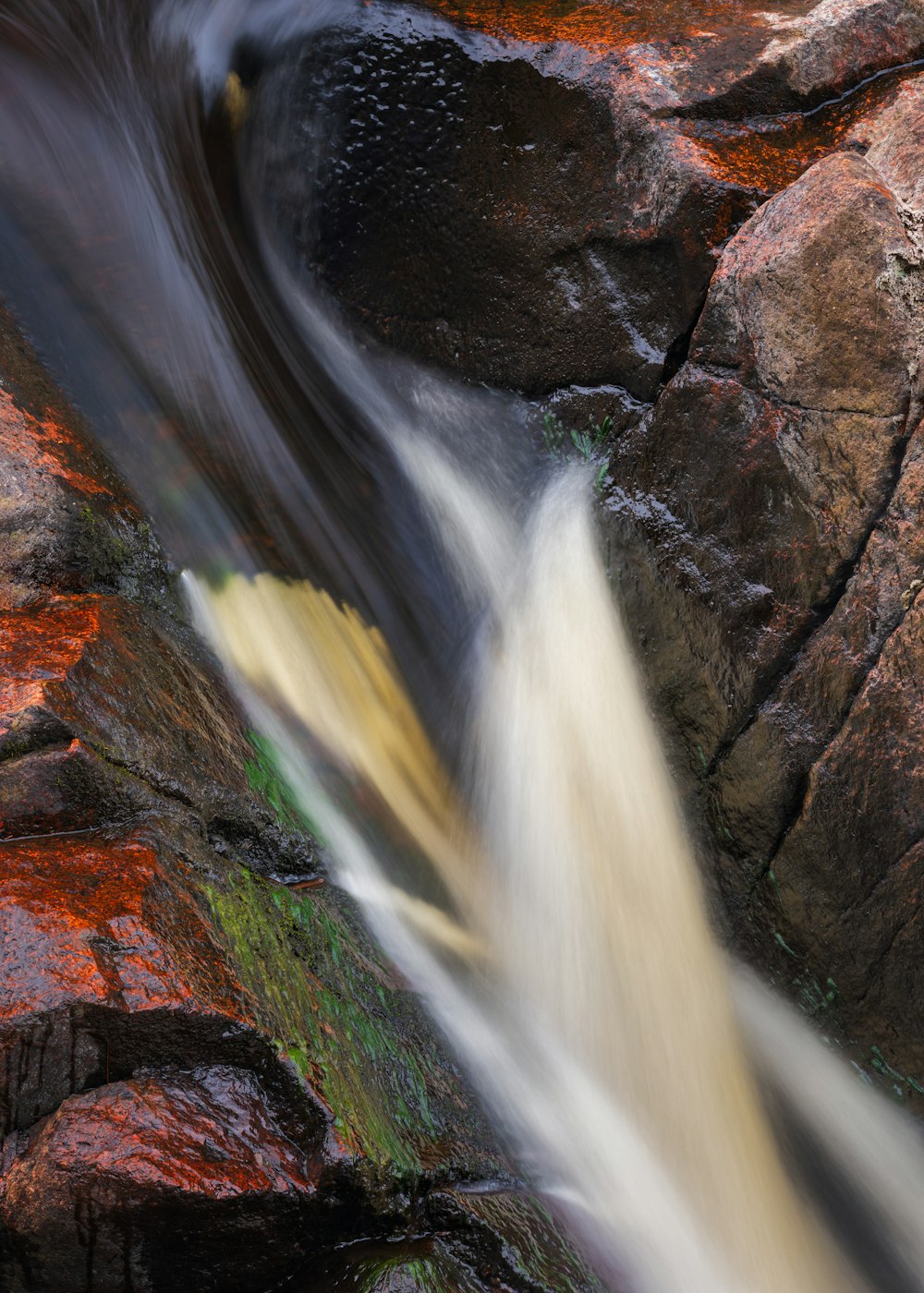 a stream of water running over rocks