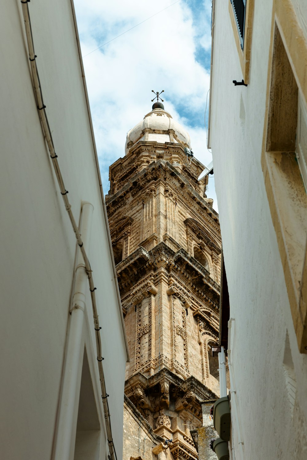 a tall clock tower towering over a city