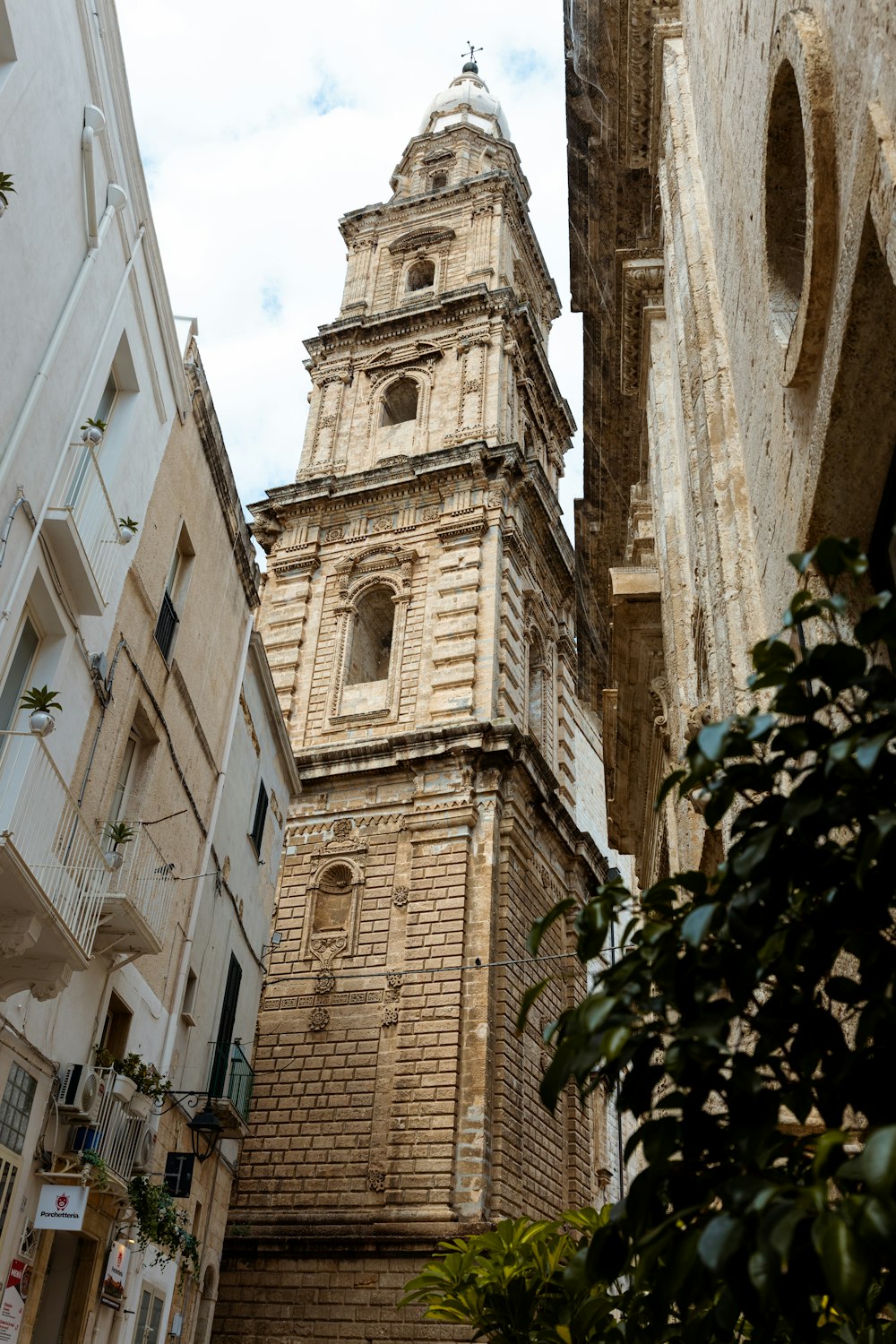 a tall clock tower towering over a city