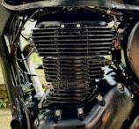 Close-up of a sleek black motorcycle engine with chrome details.