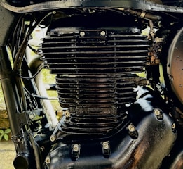 A close-up of a sleek motorcycle engine with intricate details.