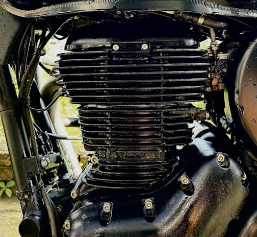 Close-up of a well-maintained motorcycle engine being inspected.