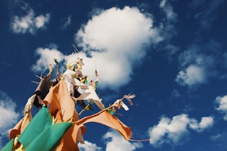 Vibrant sublimation banderines fluttering in the breeze outdoors.