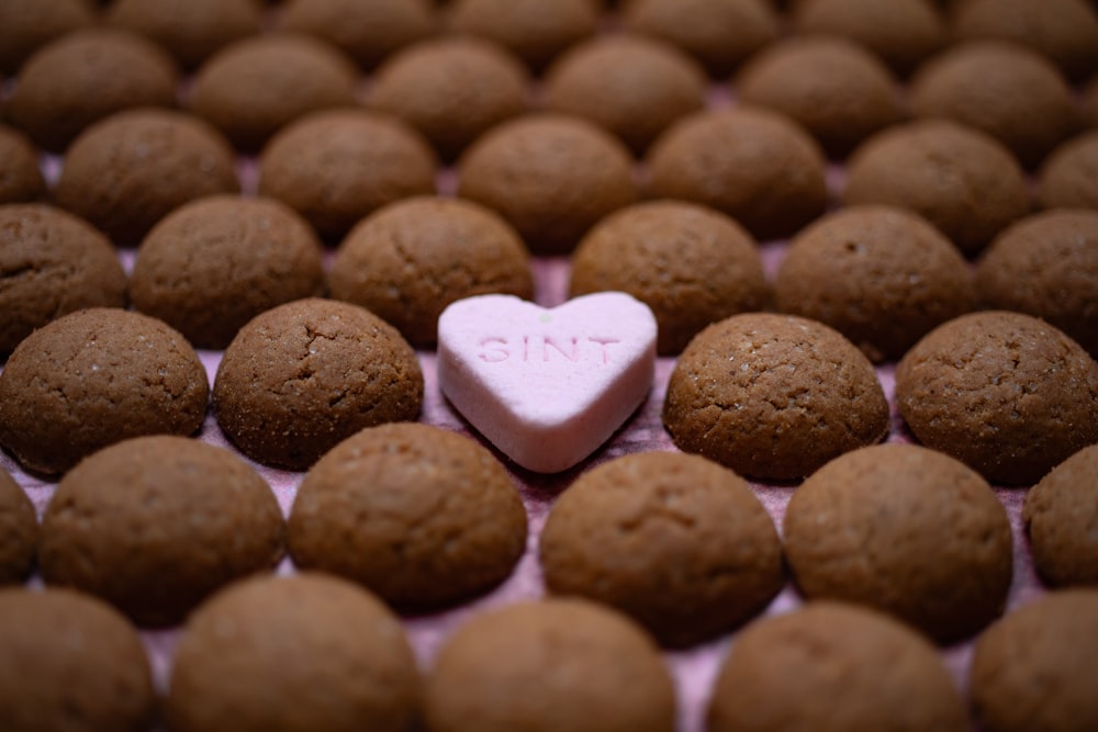 a heart shaped candy sitting on top of a table