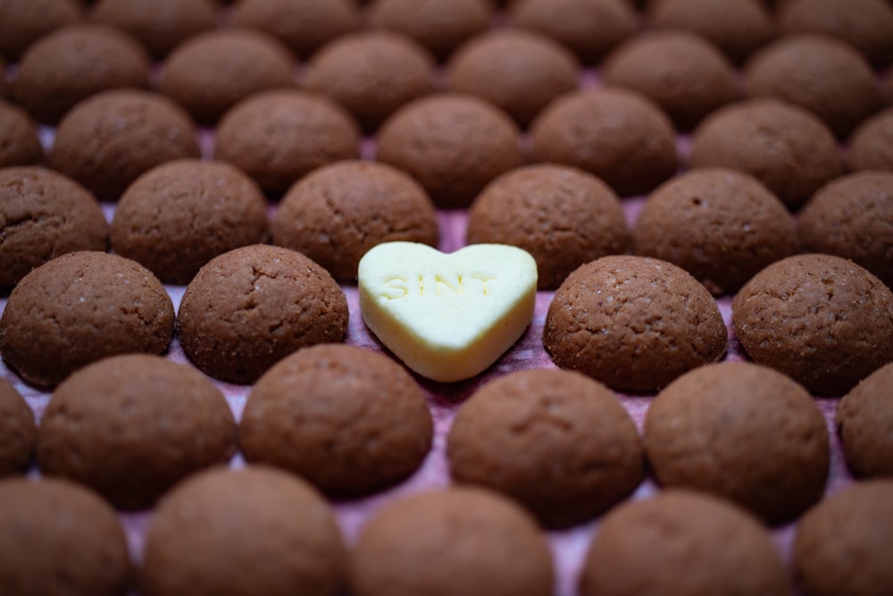 a heart shaped cookie sitting on top of a table