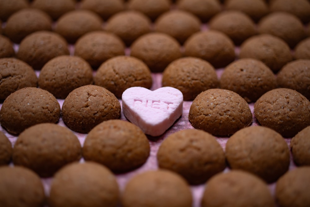 a heart shaped cookie sitting on top of a table