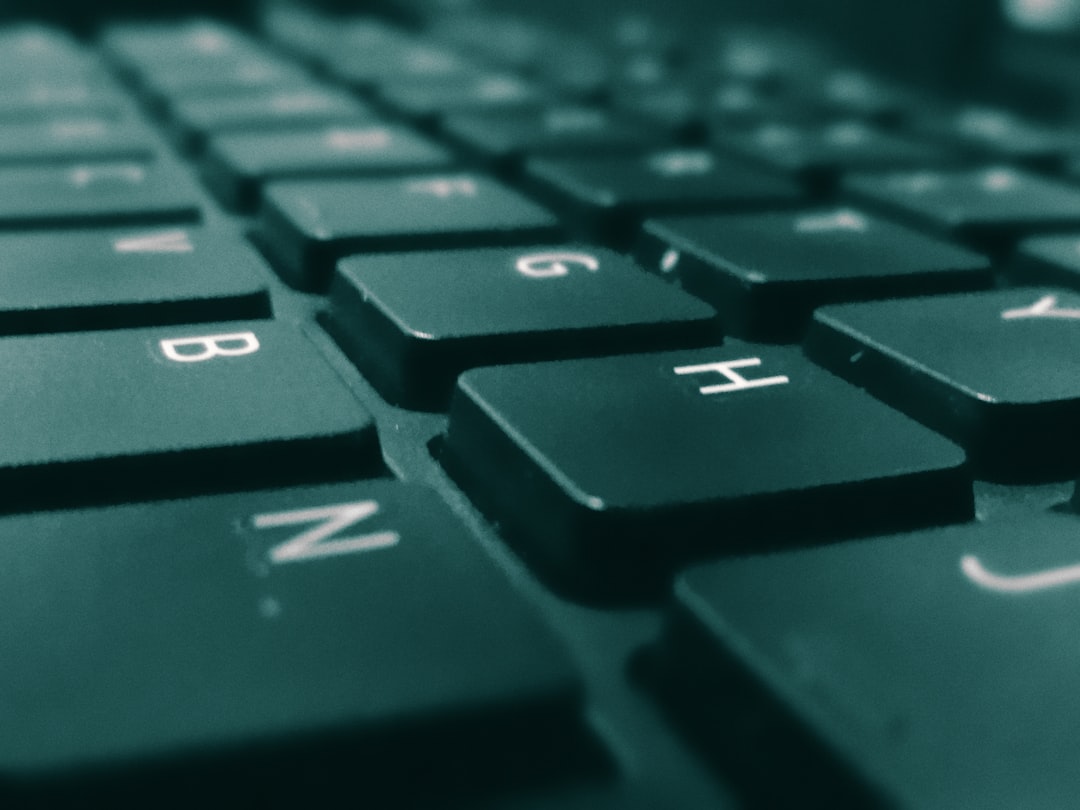 a close up of a computer keyboard with a blurry background, Panasonic DMC-FH3