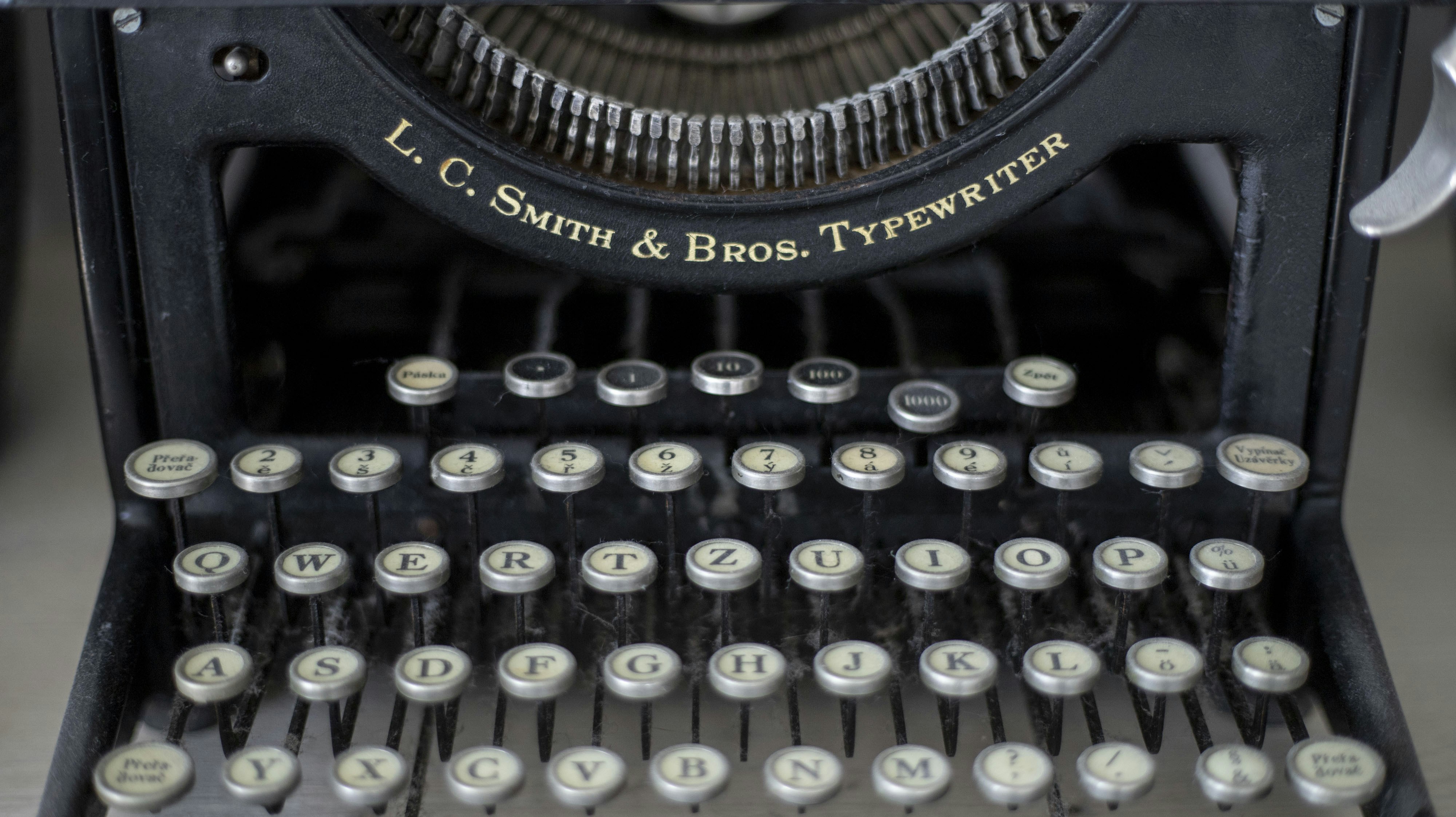 a close up of an old fashioned typewriter