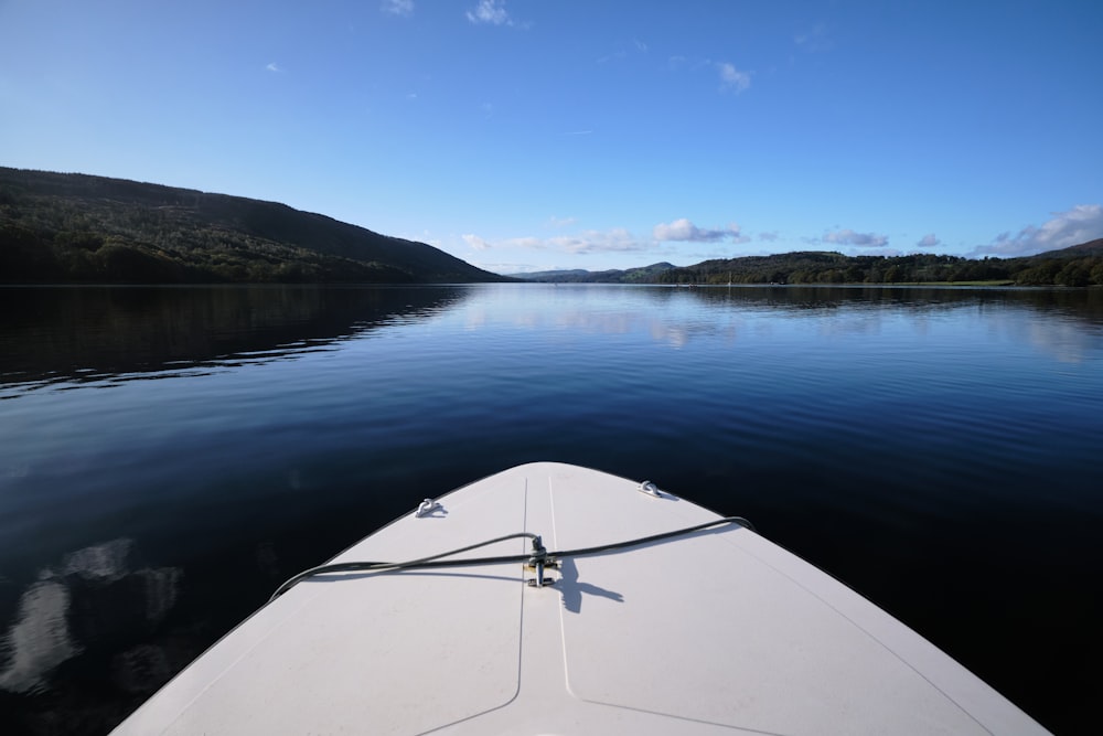 the bow of a boat on a calm lake
