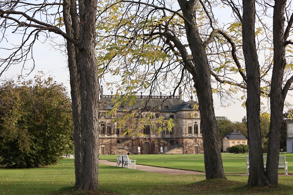 a large building with a lot of trees in front of it