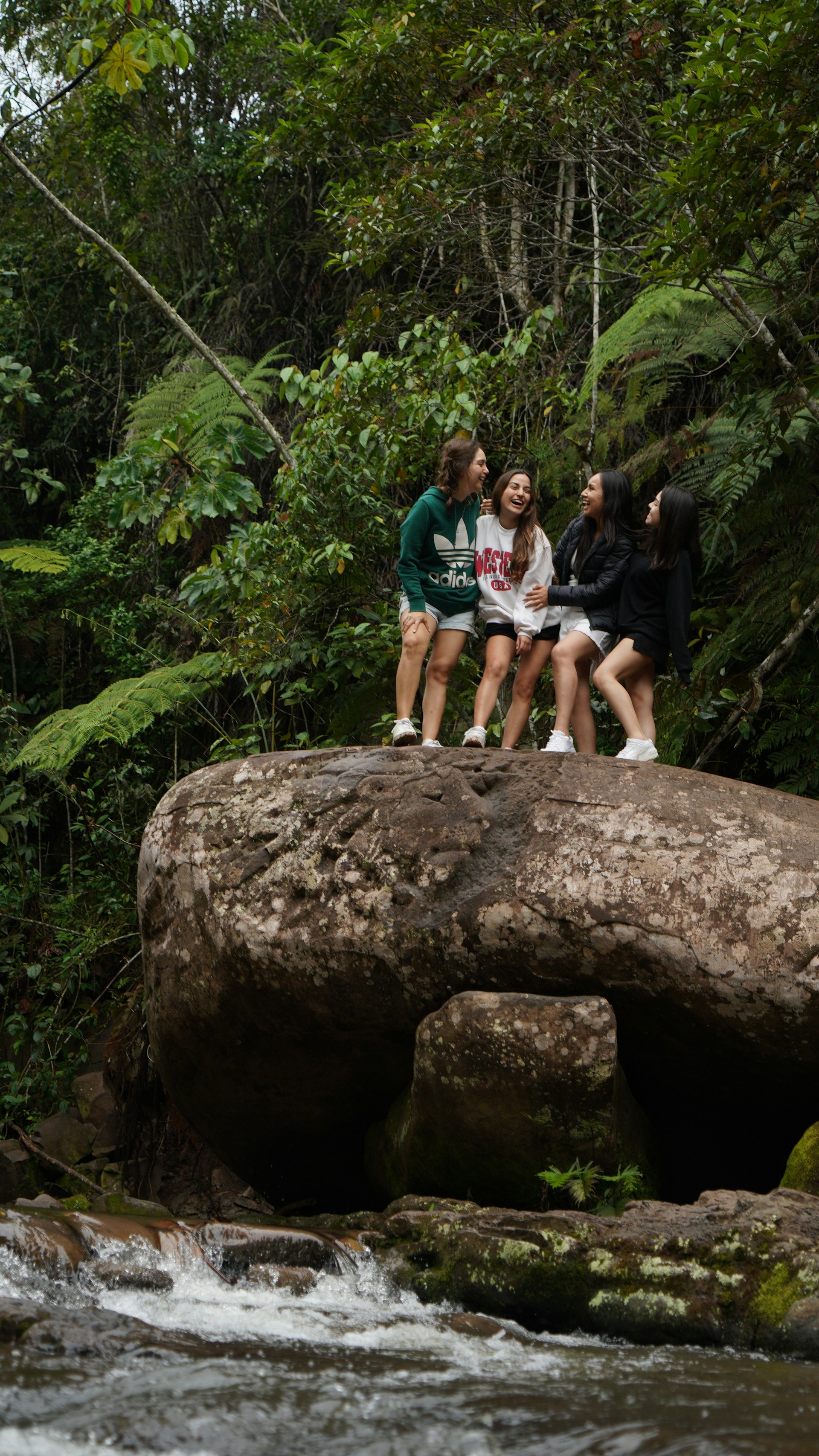 woman wearing yellow long-sleeved dress under white clouds and blue sky during daytime