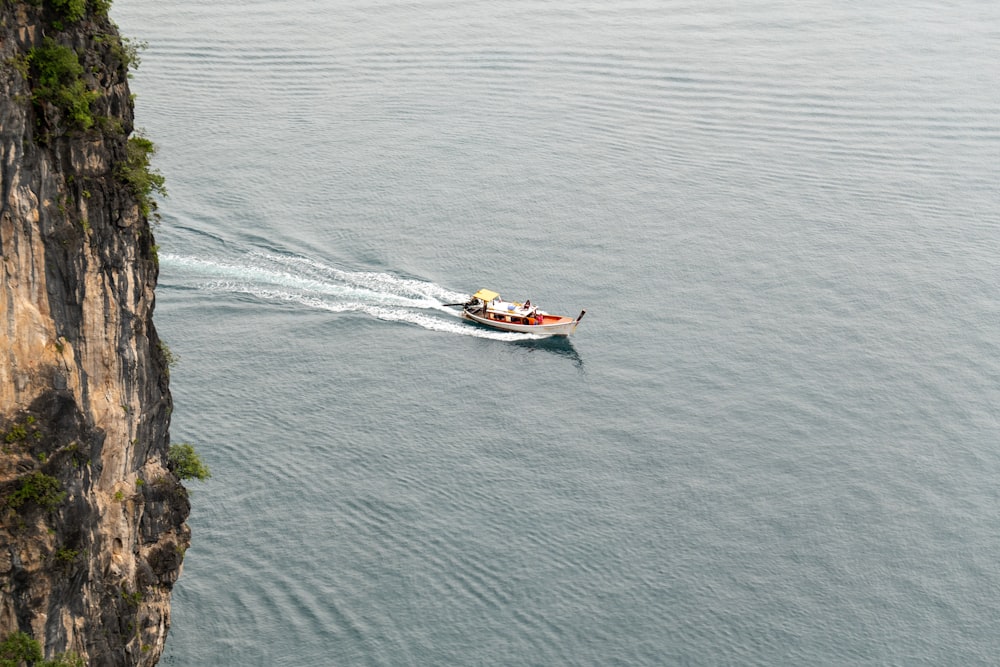 a small boat in a large body of water