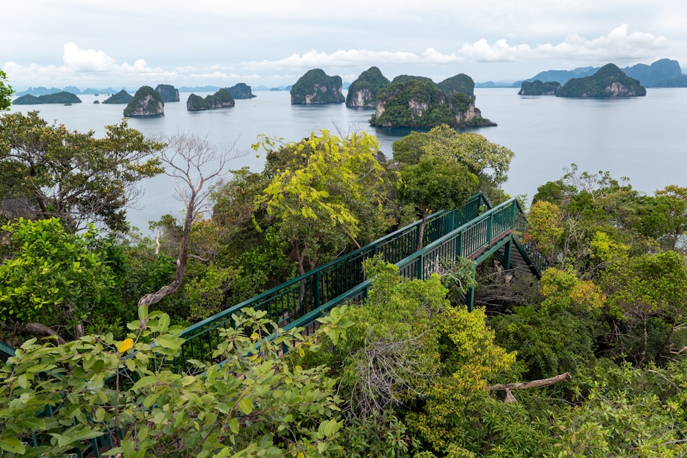 a scenic view of an island with a bridge in the middle of it