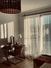 A warm, inviting home office with soft lighting and calming decor, symbolizing a safe space for online therapy sessions.