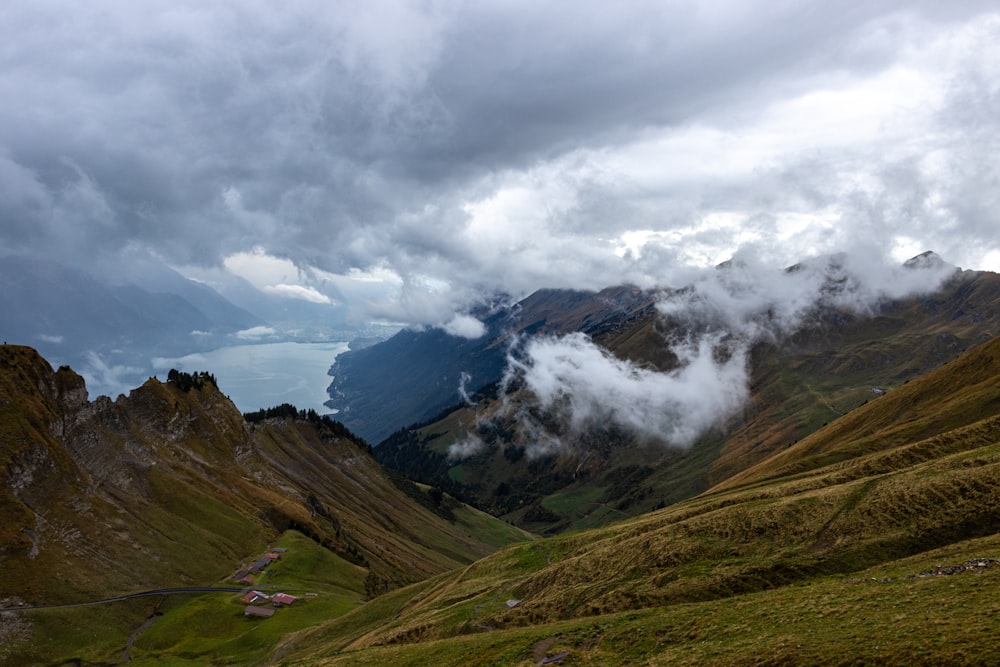 a view of a valley with mountains in the background