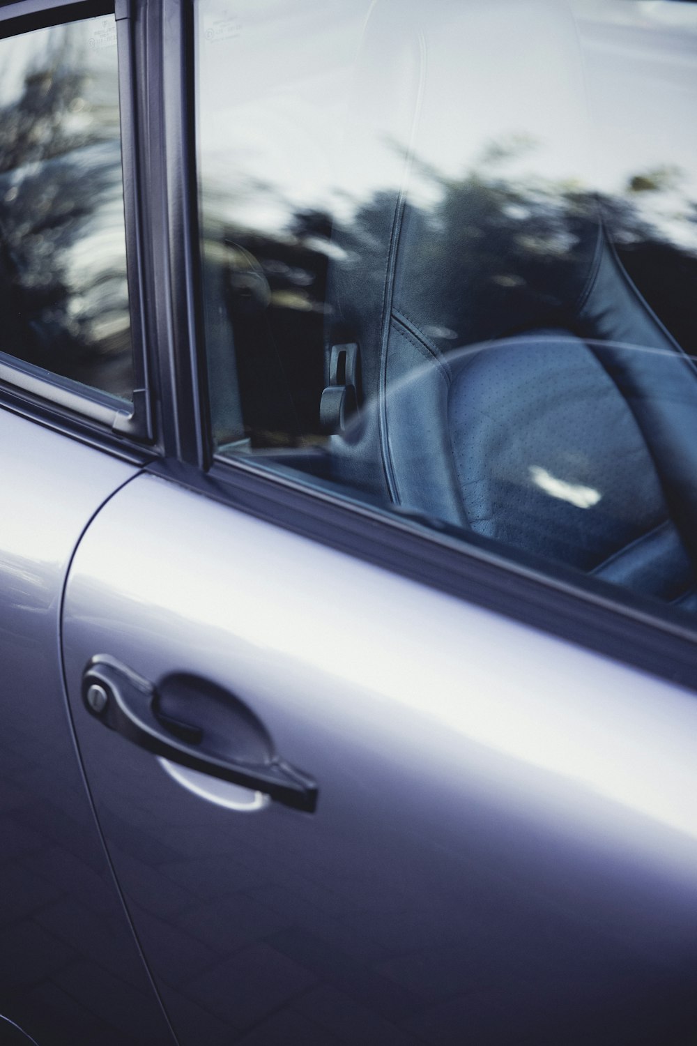 a close up of a car door with a window open