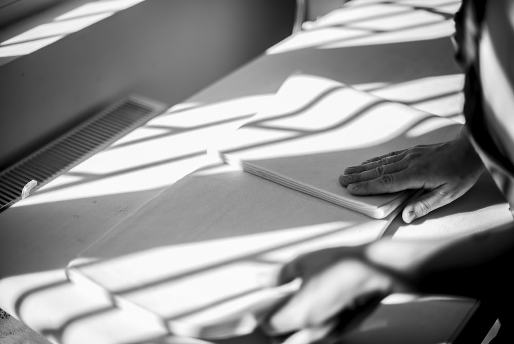 a person sitting at a table with a book