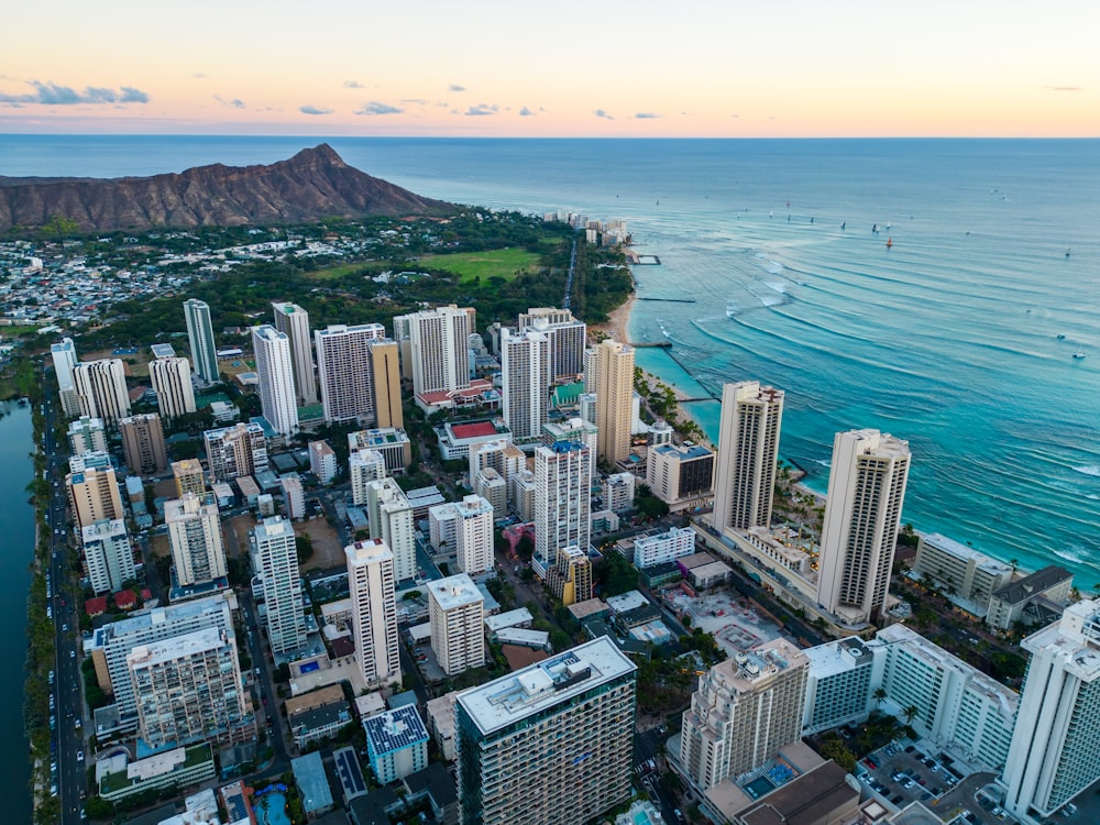 an aerial view of a city by the ocean