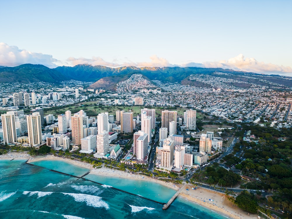 an aerial view of a city and the ocean